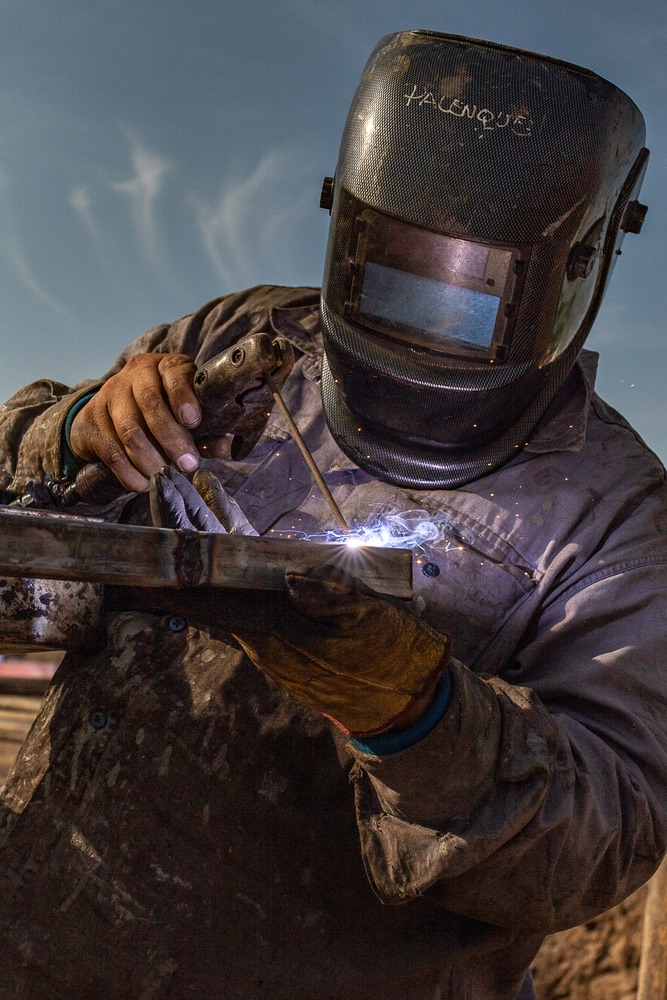 Aditri Engineering welder in protective gear welding a steel section